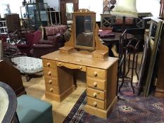 A 19thc style country pine dressing table, with rectangular swing mirror on shaped supports, with
