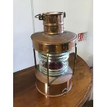 A 20thc ship's copper lantern, with copper body and brass fittings, with paraffin burner, and