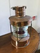 A 20thc ship's copper lantern, with copper body and brass fittings, with paraffin burner, and