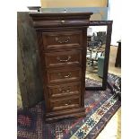 A 19thc style Continental tall chest, the square top with rounded angles, above a single frieze