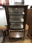 An Edwardian mahogany bow front cabinet, the top with moulded edge above a bow front door, with