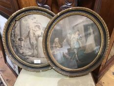 A pair of 19thc ebonised circular frames, with gadroon edge, and beaded moulding, each containing