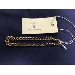 A yellow metal curb link bracelet with dog clip fastener, unmarked (16.4g)