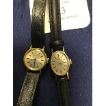 A lady's 9ct gold Omega Watch Company, oval wristwatch on leather band, together with a gold