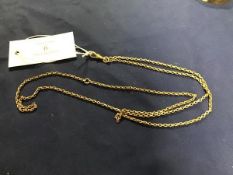 A yellow metal guard chain with dog clip and circular ring to top, unmarked (11.8g)