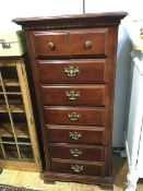 A 19thc style mahogany narrow chest, the plain top with moulded edge above a dentil cornice,
