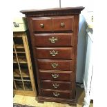 A 19thc style mahogany narrow chest, the plain top with moulded edge above a dentil cornice,