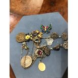 A mixed lot of costume pendants and necklaces, together with two school medals