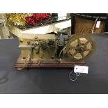 A rare French brass morse code telegraphic ticker tape inker, c.1900, with spring driven clockwork