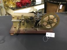 A rare French brass morse code telegraphic ticker tape inker, c.1900, with spring driven clockwork