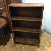 A 1930s/40s oak open waterfall bookcase, the rectangular top with moulded edge above three open