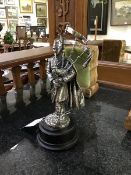 A silver plated figure of a Piper in full dress on turned wood stand, Ballantynes of Walkerburn