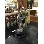 A silver plated figure of a Piper in full dress on turned wood stand, Ballantynes of Walkerburn