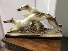 Le Manceau, a pottery figure group of two racing Greyhounds, impressed mark verso (31cm x 53cm x