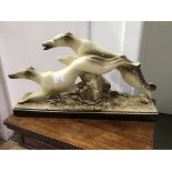 Le Manceau, a pottery figure group of two racing Greyhounds, impressed mark verso (31cm x 53cm x