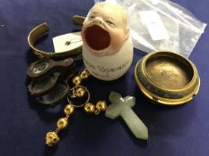 A mixed lot including a carved agate crucifix, an Indian bangle and bead ring, a horn framed