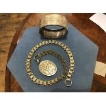 A Victorian engraved white metal bangle, Mary, and a fancy link chain with oval engraved locket (2)