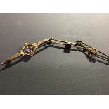 Three Victorian bar brooches including a 9ct gold brooch set amethyst together with a yellow metal