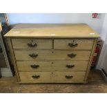 An early 20thc ash chest of drawers, the plain rectangular top above two short and three long