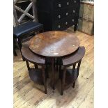 A 1930s walnut circular coffee table with nest of four quarter shaped tables (33cm x 60cm) (a/f)