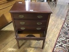 An early 20thc mahogany four drawer music cabinet, the rectangular top with moulded edge above