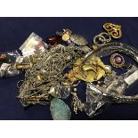 A bag containing a group of costume jewellery including pendants, brooches, earrings etc. (a lot)