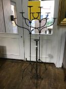 A pair of steel five arm candelabra on single column and tripod base together with a single