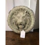 A 19thc. circular lion's head plaster cast wall applique (losses) (31cm)