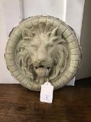 A 19thc. circular lion's head plaster cast wall applique (losses) (31cm)