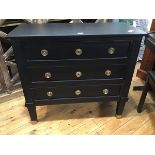 A modern ebonised chest of drawers in Napoleon III style, the plain rectangular top above three long