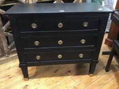 A modern ebonised chest of drawers in Napoleon III style, the plain rectangular top above three long