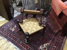 A pair of African rush topped stools on hardwood frames with turned supports (each: 32cm x 46cm x