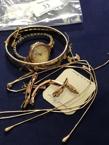 A mixed lot of jewellery including a lady's 9ct gold wristwatch together with a Northmans style axe,