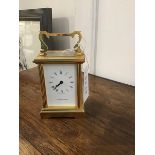 A brass four glass carriage clock with white dial and roman numerals (missing glass to front) (h.