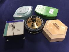 A group of five Art Deco dressing table boxes including glass, metal, bakelite and plastic