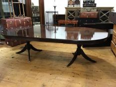 A Swiss reproduction solid mahogany D end dining table, the plain top with reeded edge, above a