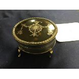 An oval silver and tortoiseshell jewellery box, inset Pique to top, on a plain body, raised on