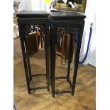A pair of tall Chinese jardiniere stands, each with square top and pierced frieze incorporating