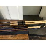 A mixed lot of fishing rods, including two Daiwa graphite Strikeforce rods and cover, a Milbro trout