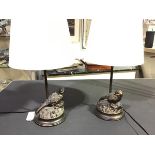 A pair of bronzed composition table lamps, the naturalistic moulded circular bases with perched game