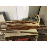 A mixed lot of fishing rods including a Hardys four piece split cane trout rod (one tip broken), a