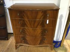 A 1950's serpentine fronted mahogany chest of drawers, the plain top with reeded edge above four