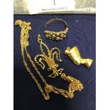 A mixed lot of gold and yellow metal jewellery, including a 9ct gold ring, a fleur de lys pendant