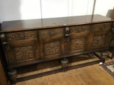 An oak Gothic Revival style sideboard, the rectangular top with moulded edge above four frieze
