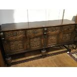 An oak Gothic Revival style sideboard, the rectangular top with moulded edge above four frieze