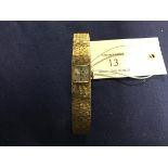 A lady's Accurist 9ct gold wristwatch and strap (26.1g)