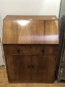 A 1930s/40s mahogany bureau, possibly Heals of London, the plain top above a fall front enclosing