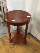 A reproduction cherrywood circular table in Napoleon III style , the crossbanded top with moulded