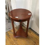 A reproduction cherrywood circular table in Napoleon III style , the crossbanded top with moulded