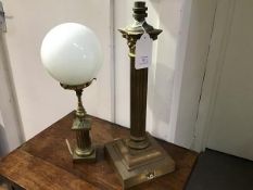 An early 20thc Corinthian column brass table lamp, converted from paraffin, together with another